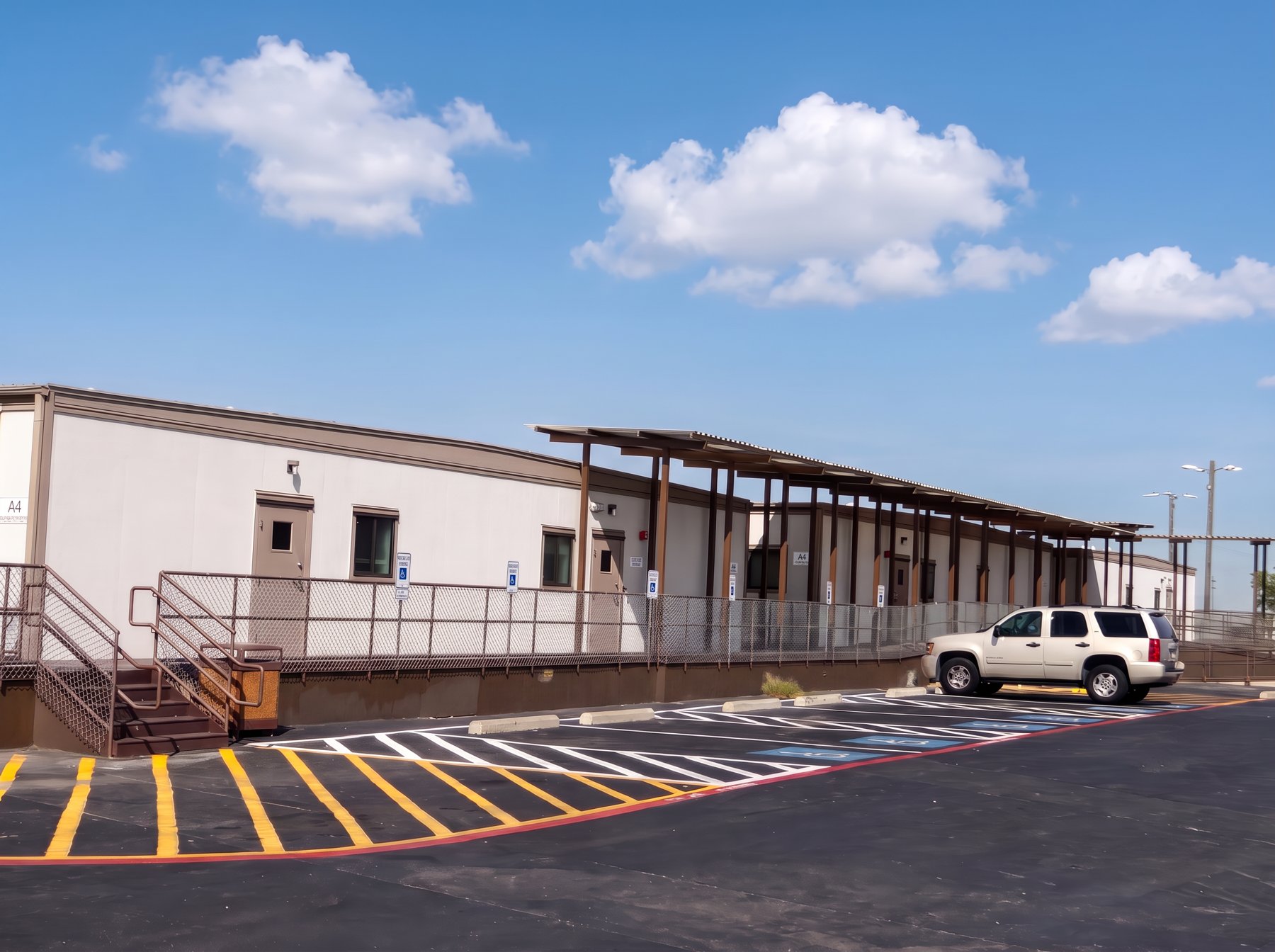 Commercial modular building complex with covered walkway and accessible parking